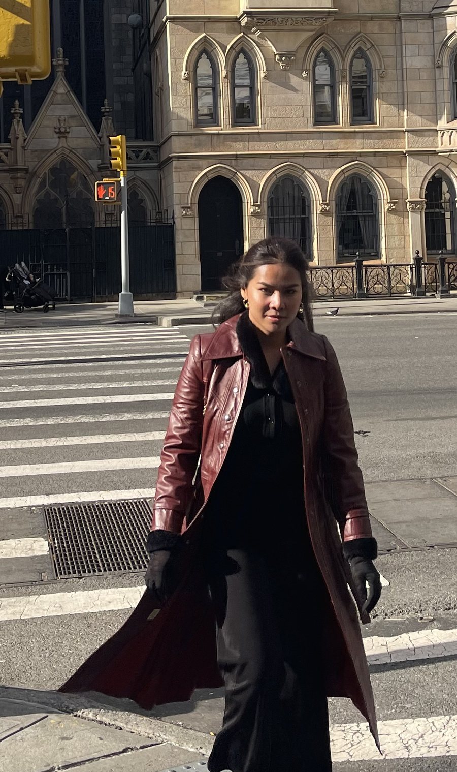 Thanya Rittidech crossing a street corner in New York.